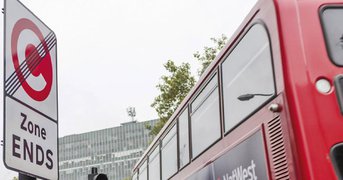 Congestion charge ending sign, bus exits.