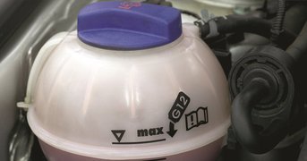 Engine coolant receptical tank.