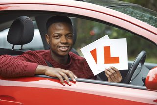 Man holding Learner Plates