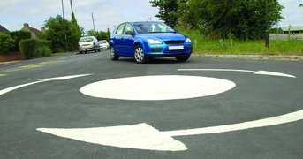 Car manoeuvring at mini-roundabout