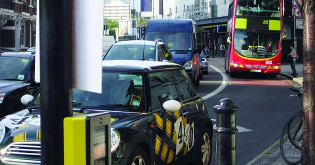 London traffic, rush-hour commute, day.