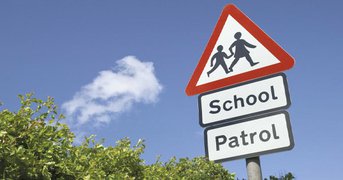 School patrol roadsign, day.